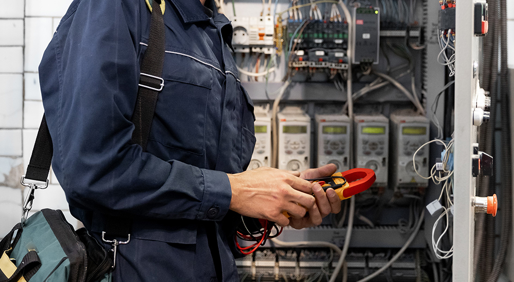 Commercial electrician at work